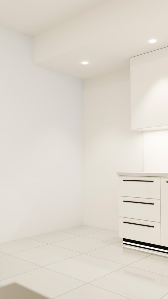 White modern kitchen corner with drawers and tile flooring