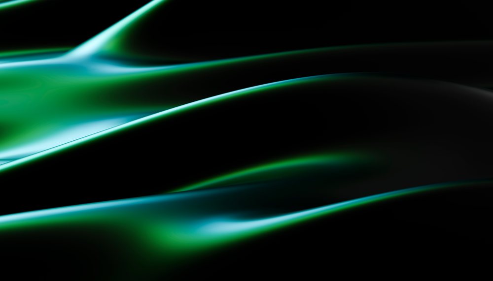 Smooth flowing blue and green abstract waves on dark background