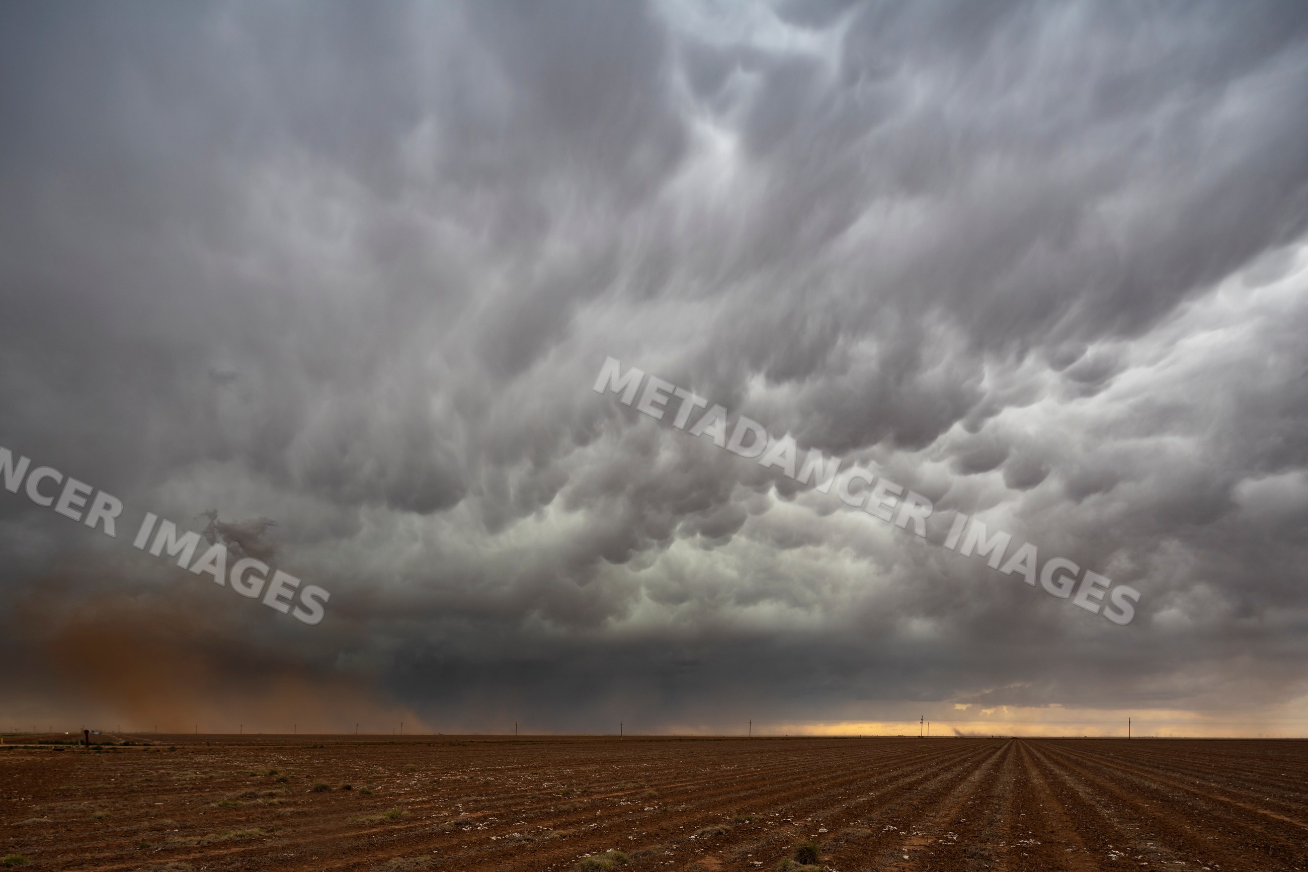 Storm clouds receding over Harvested Cotton Field in floydada, texas