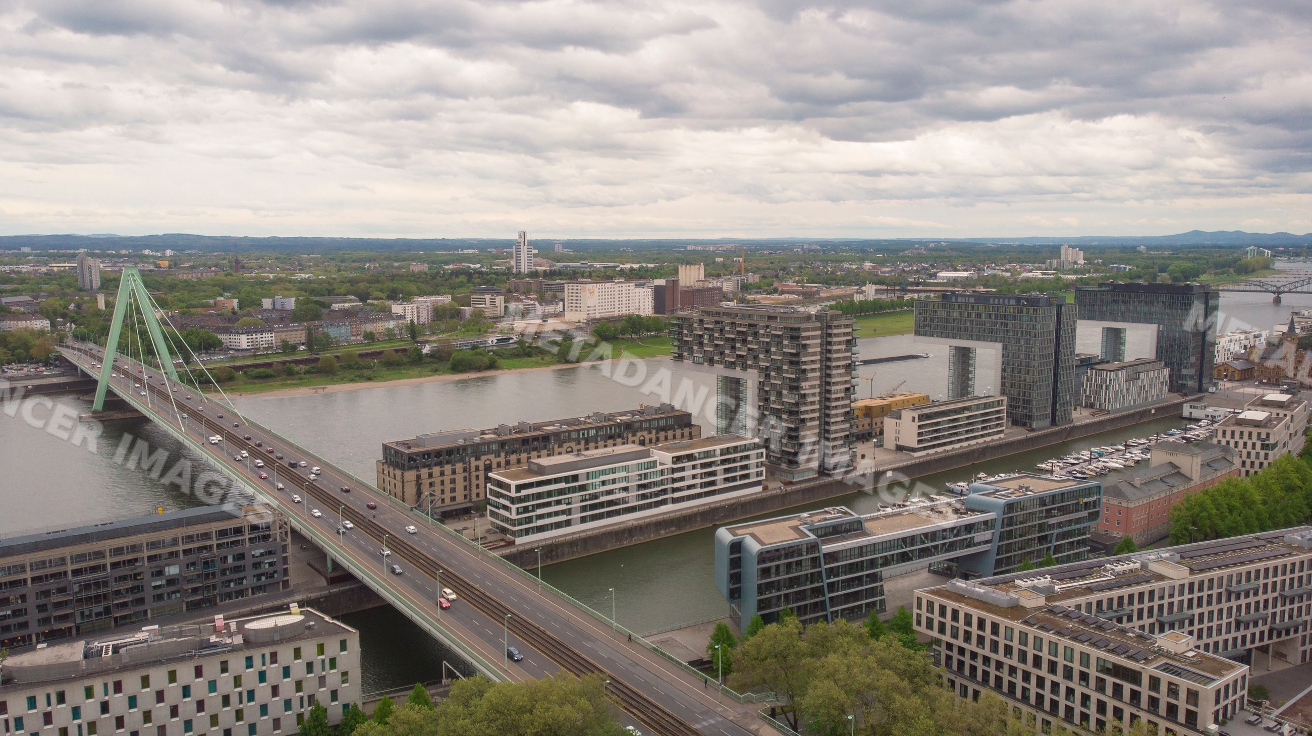 Bridge and modern buildings along river Rhine, Cologne