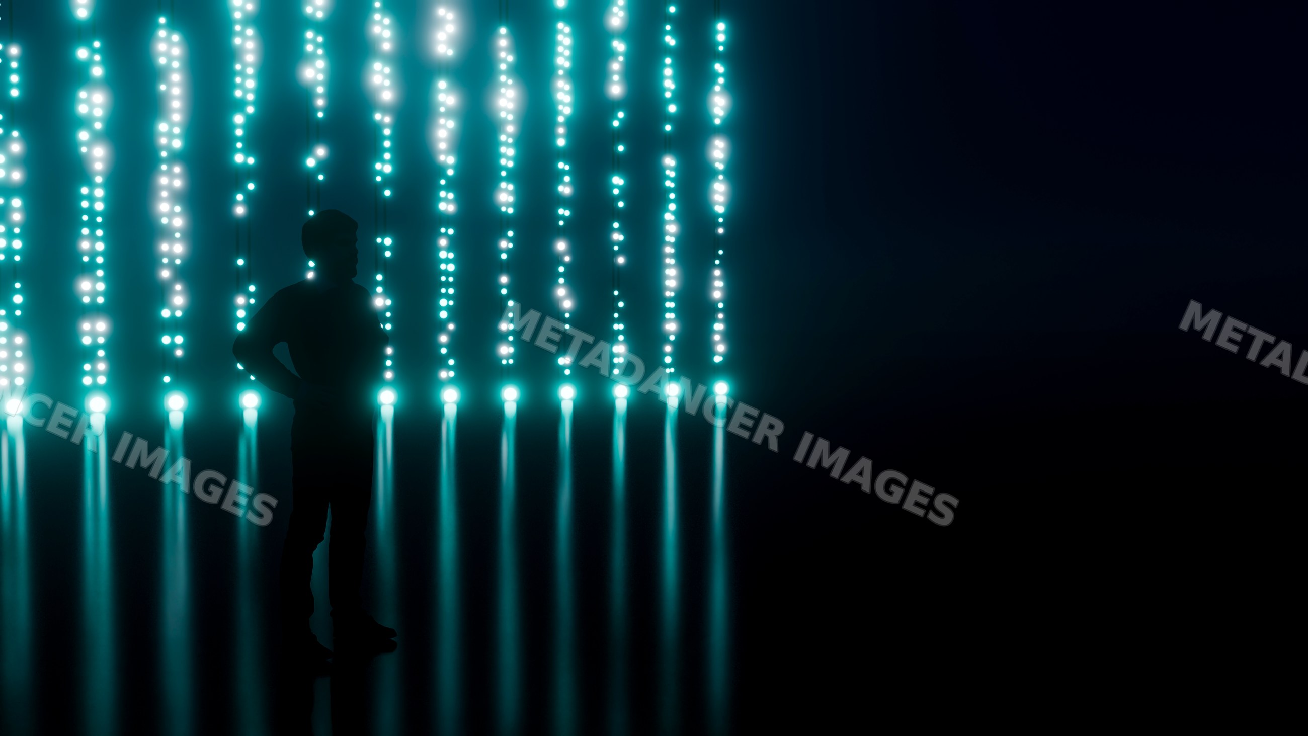 Silhouette of man with vertical blue light strands on dark background