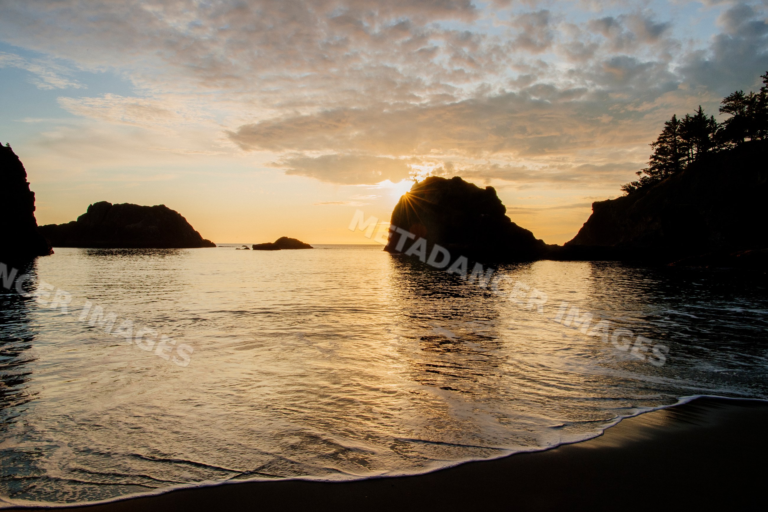 Sunset over ocean and rock formations Oregon