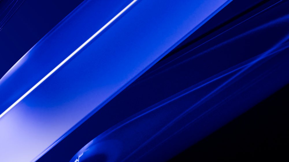 Abstract composition of smooth blue glass rods with reflective