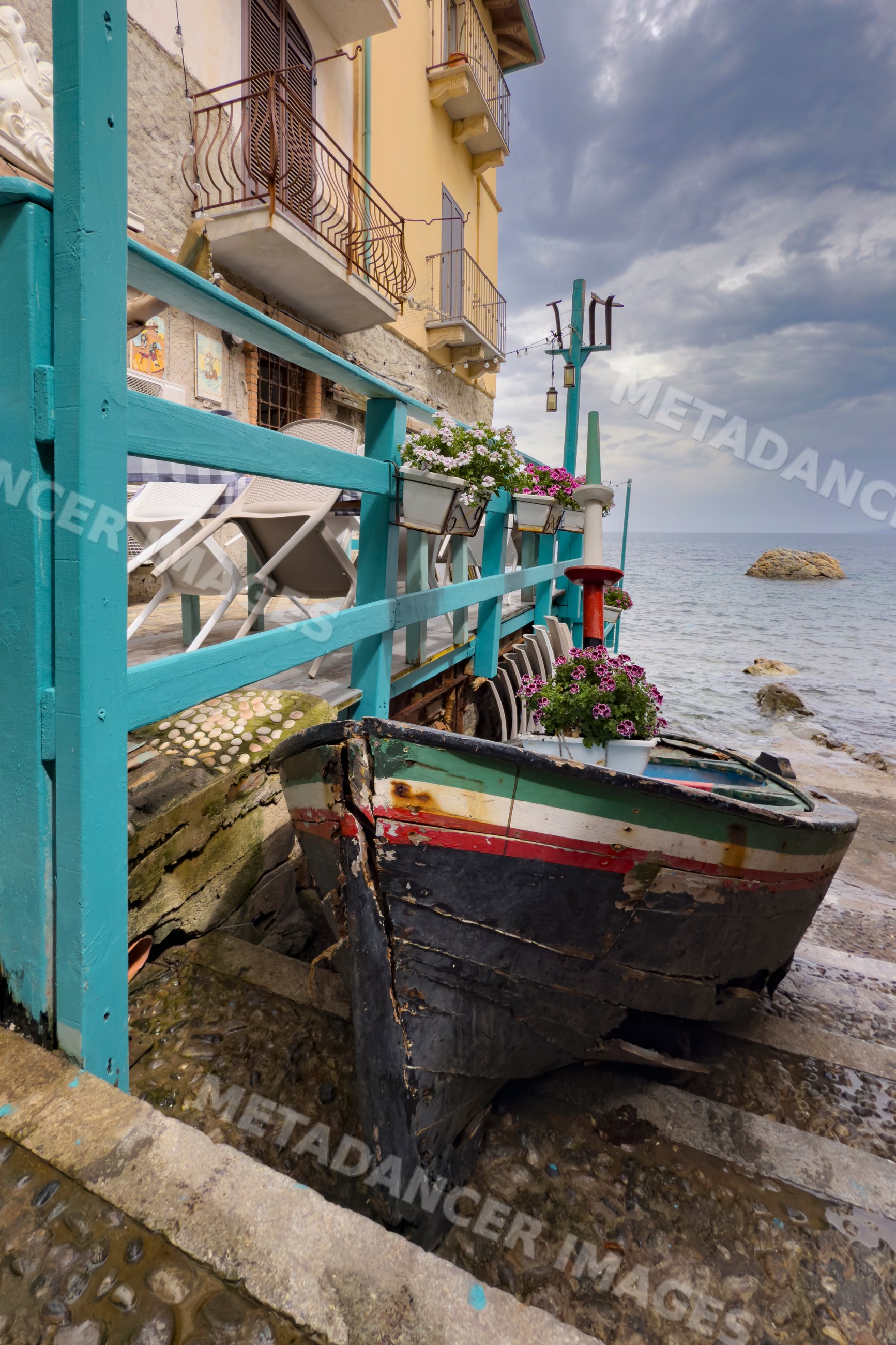 Fishing Boat on Narrow Street waterfront in chianalea, scilla, Italy