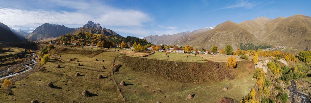 Sioni Village autumn landscape with haystacks