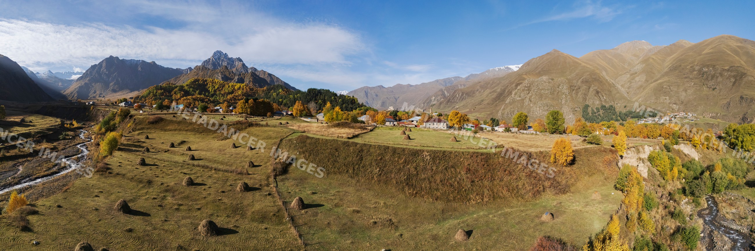 Sioni Village autumn landscape with haystacks