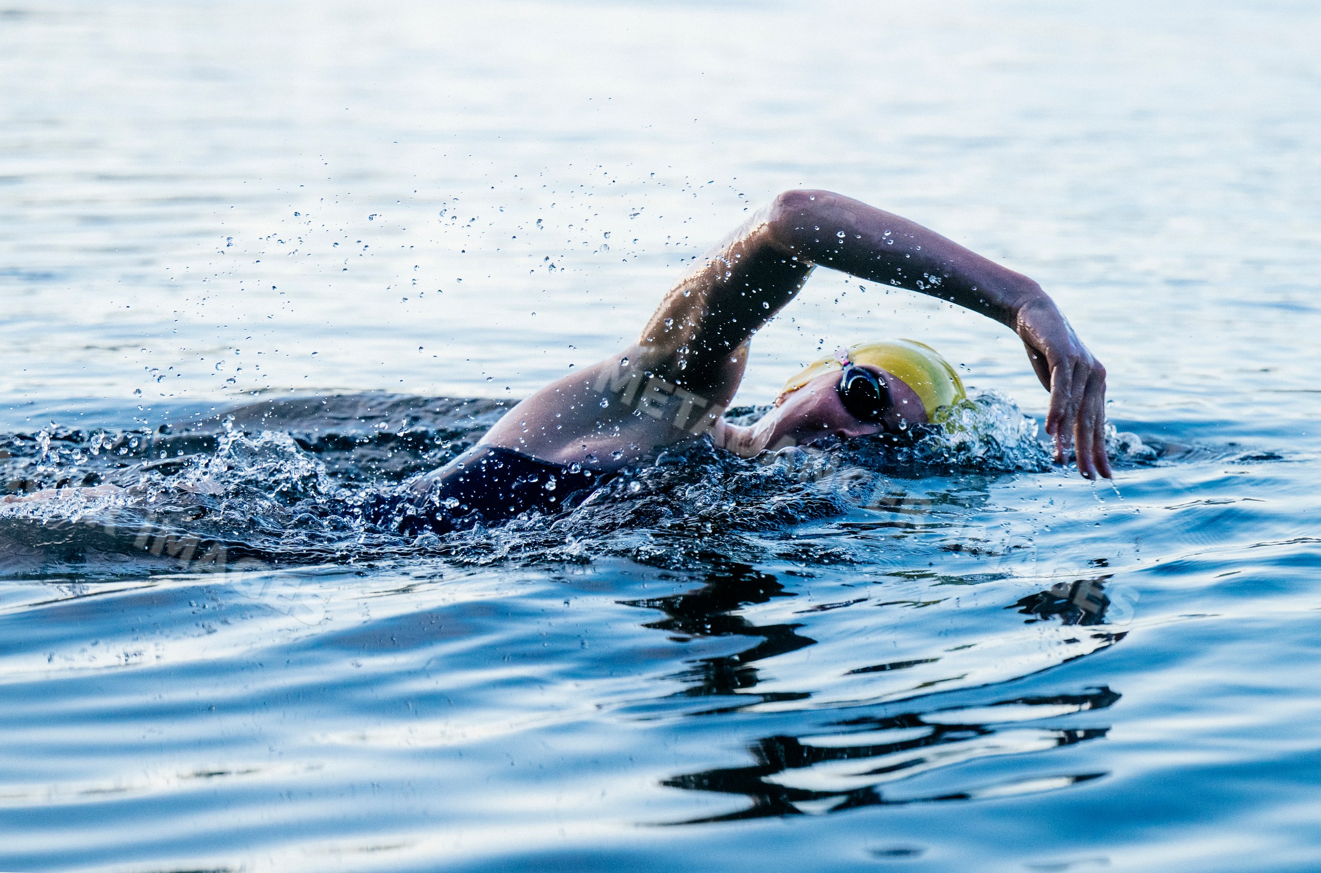 White swimmer performing freestyle stroke