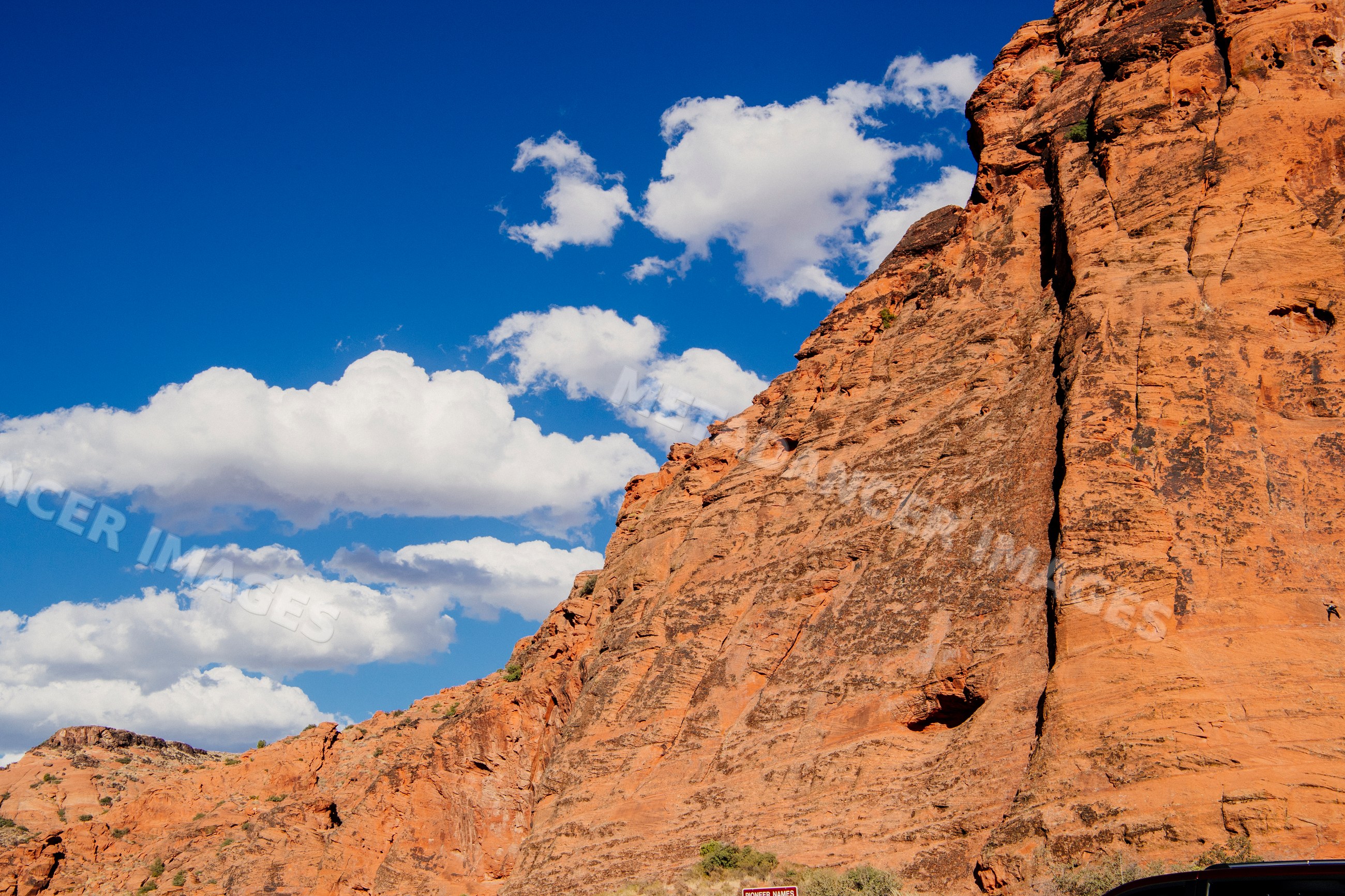 Red rock cliffs under blue sky at red Cliffs Desert State Park