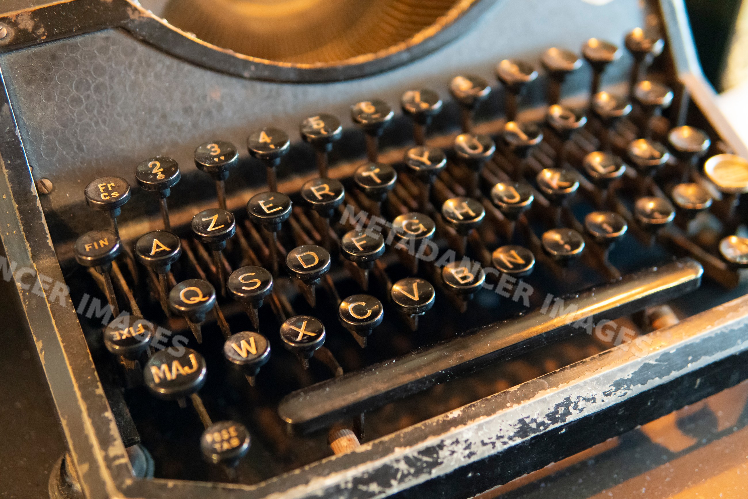 Close-up of vintage typewriter keys with letters and numbers