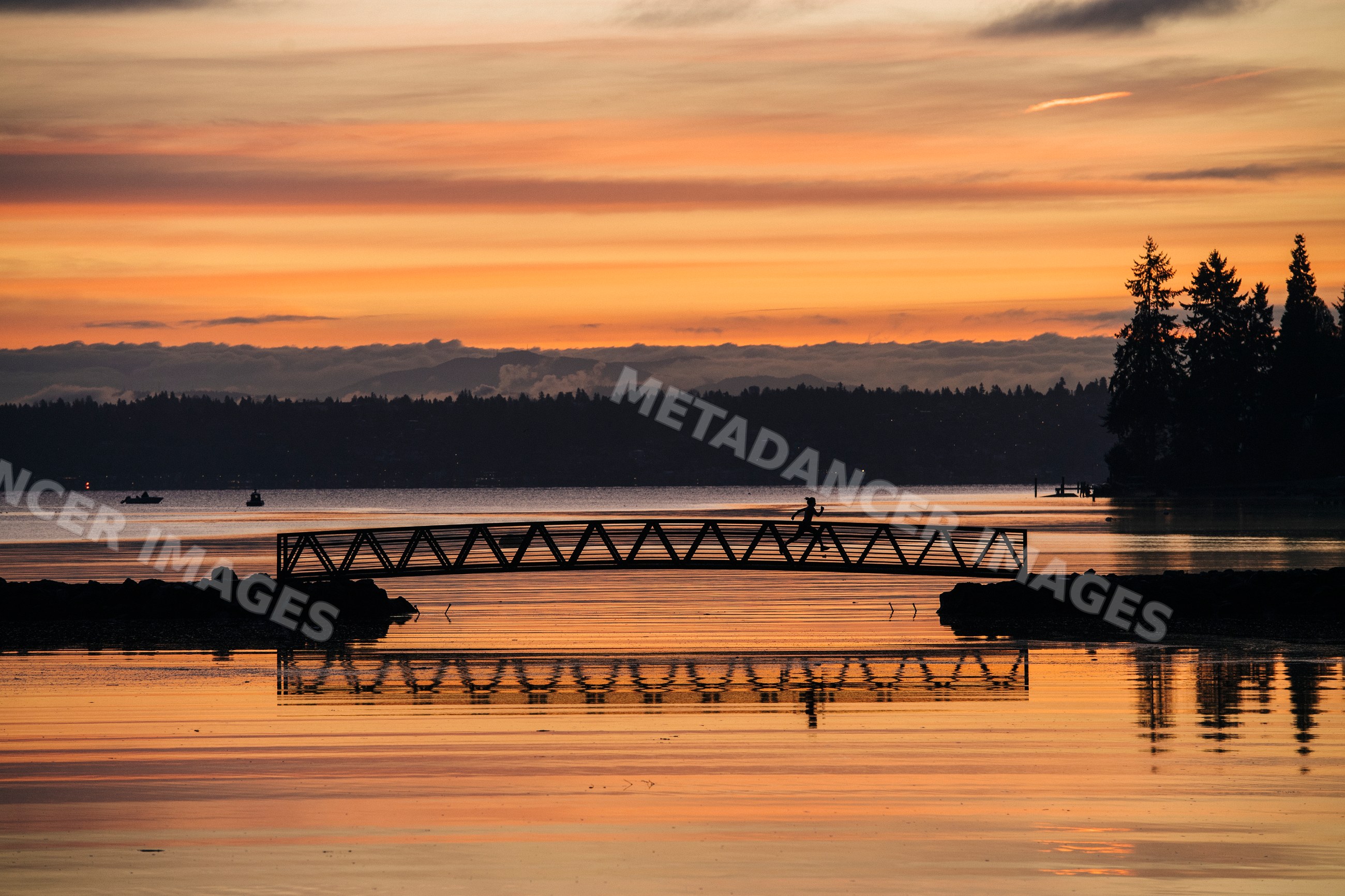 Pacific Islander runner crossing bridge