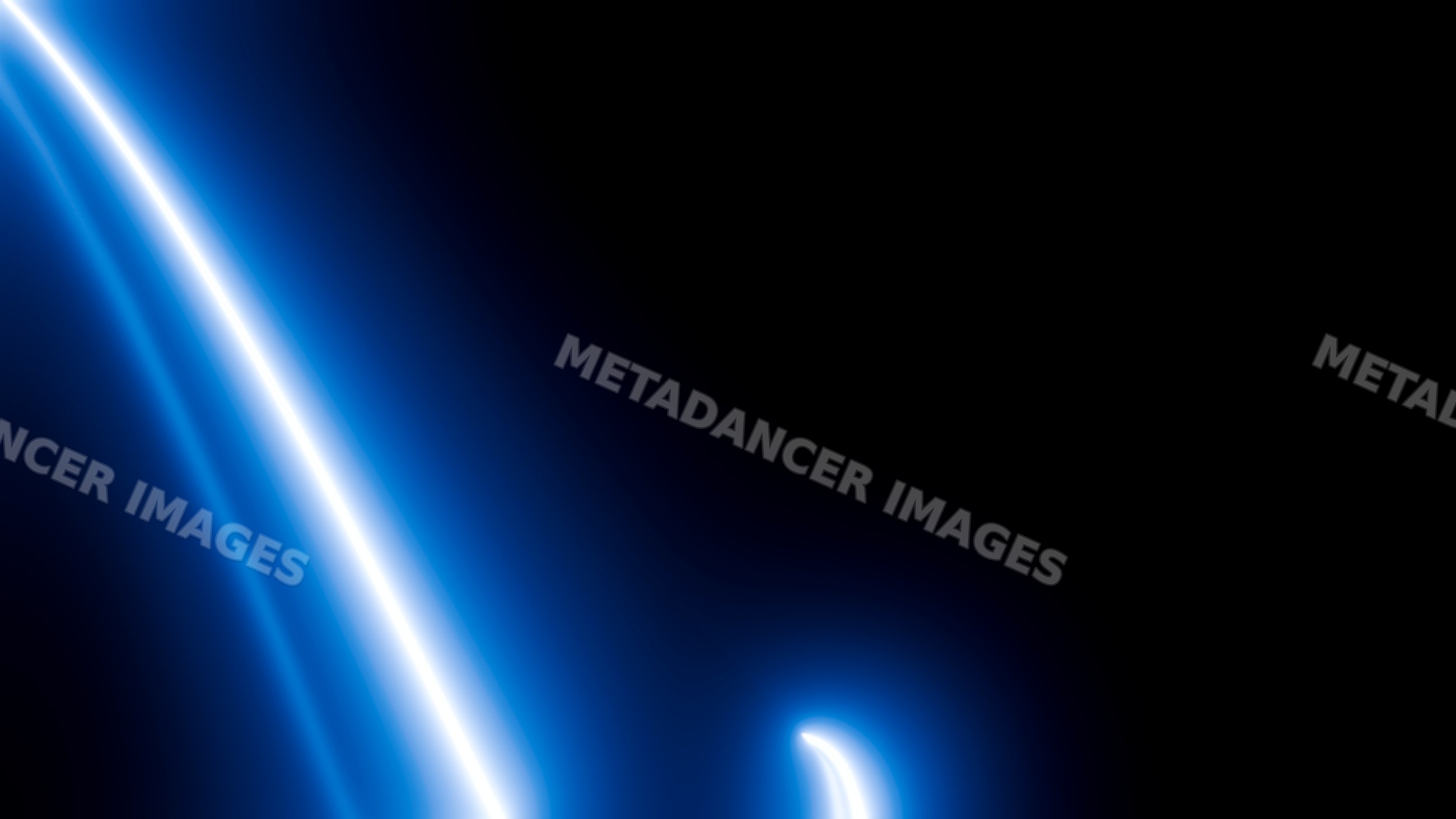 Abstract blue glowing light trails on dark background