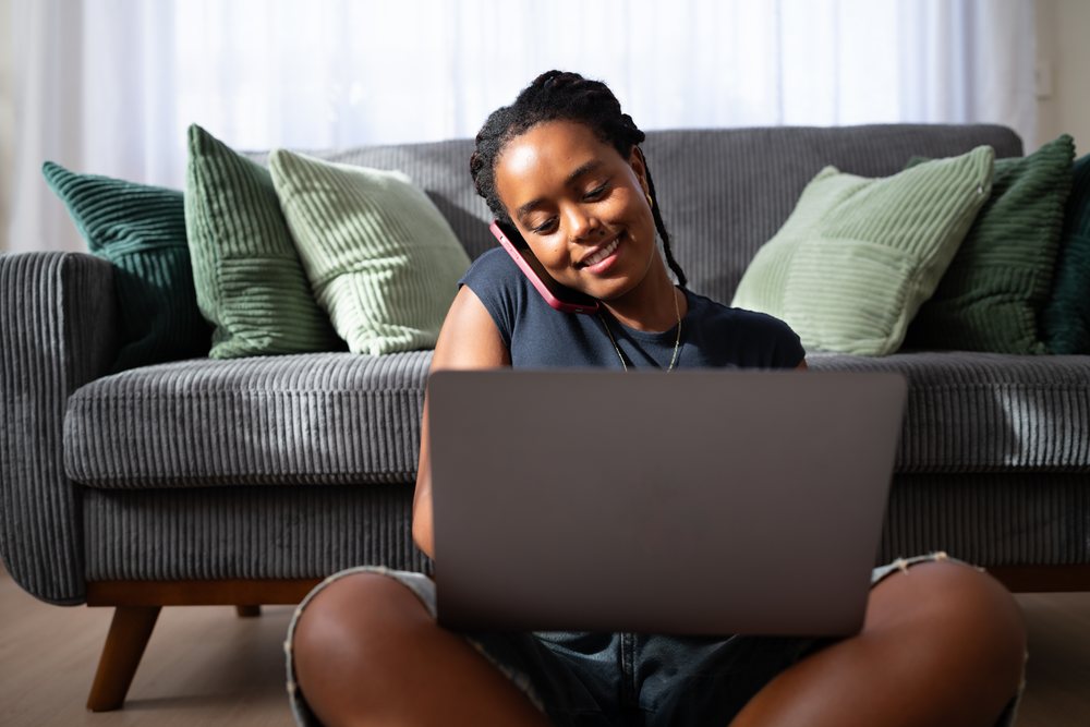 African American woman sits on the floor