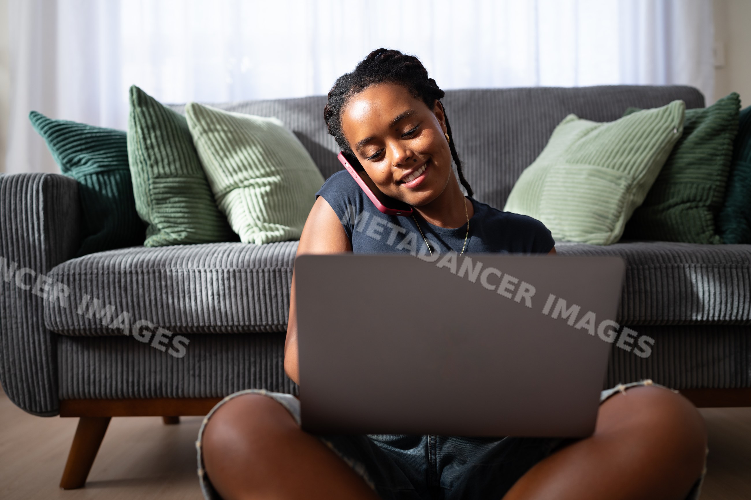 African American woman sits on the floor