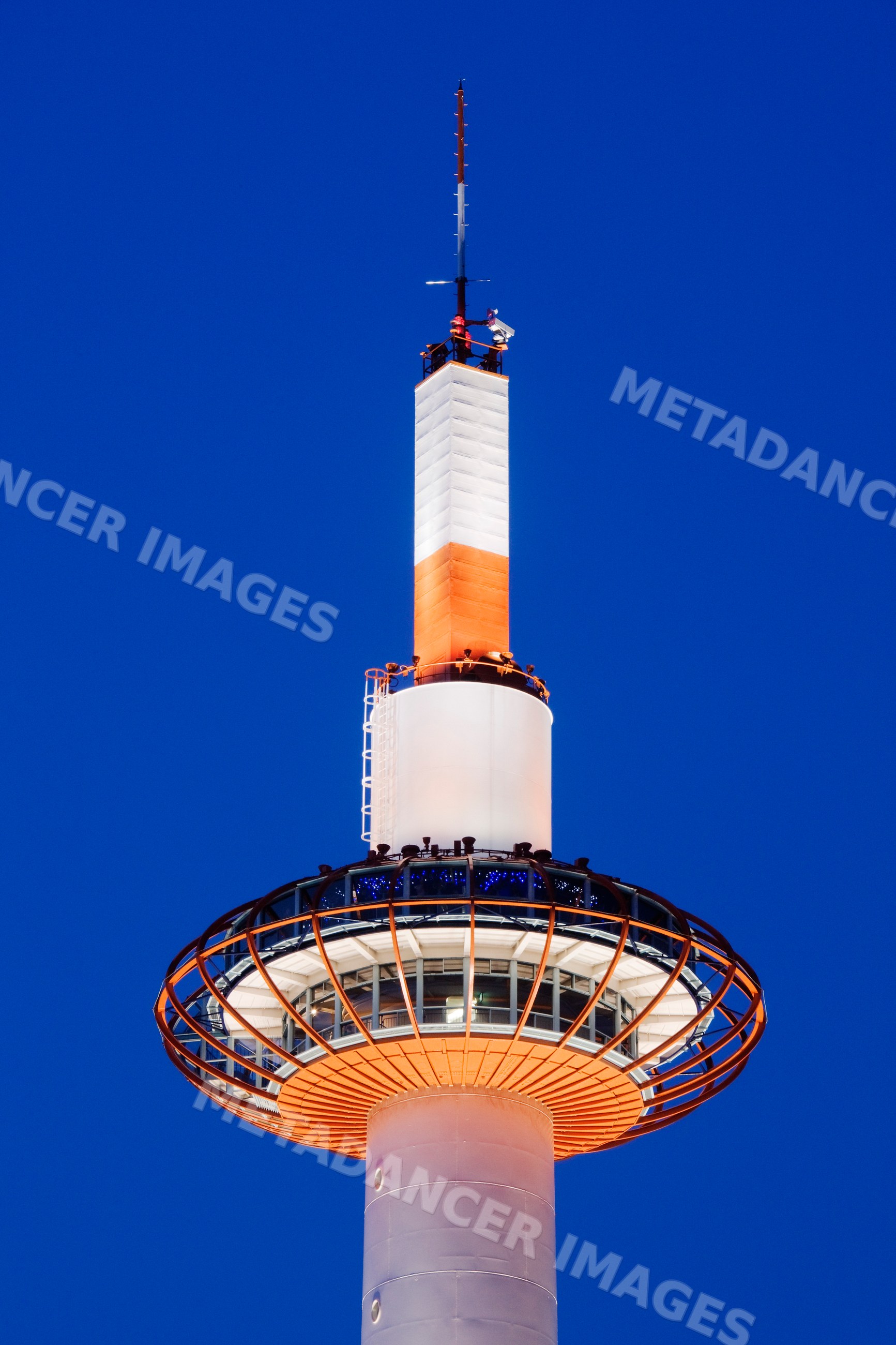 Kyoto tower observation structure illuminated at night japan