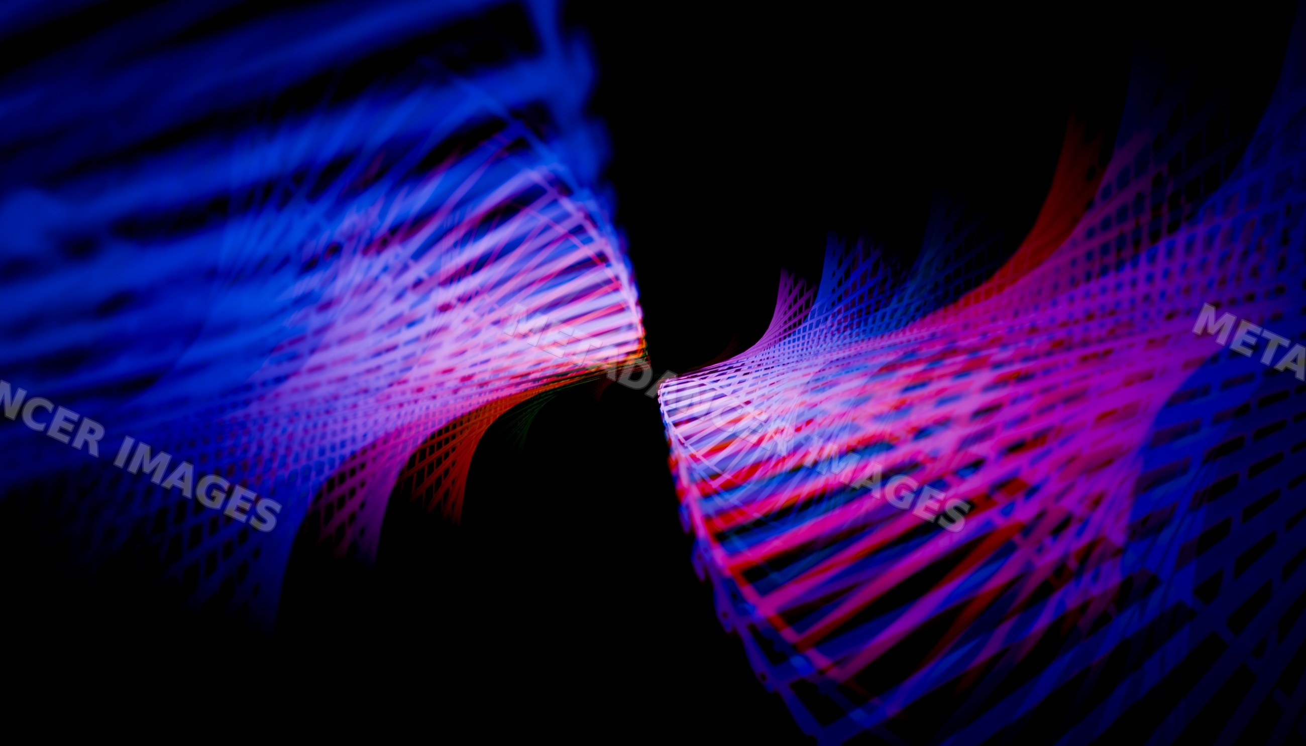 Colorful abstract light trails form dynamic wave patterns on a dark