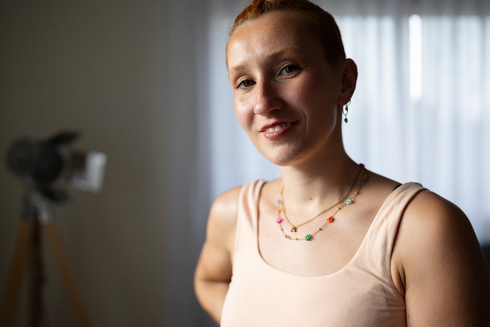 Smiling white woman with short hair indoors at home in Galicia Spain
