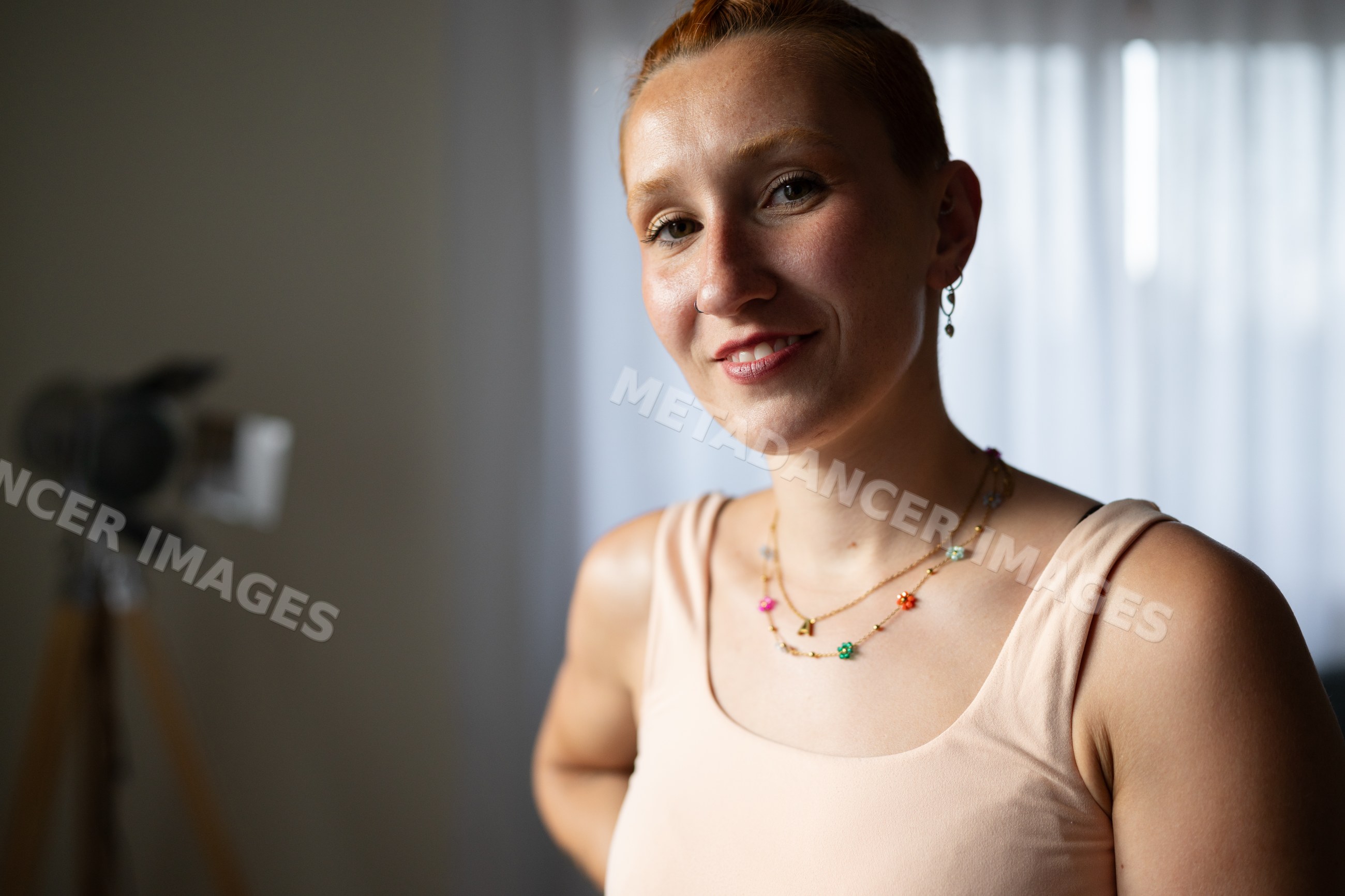Smiling white woman with short hair indoors at home in Galicia Spain