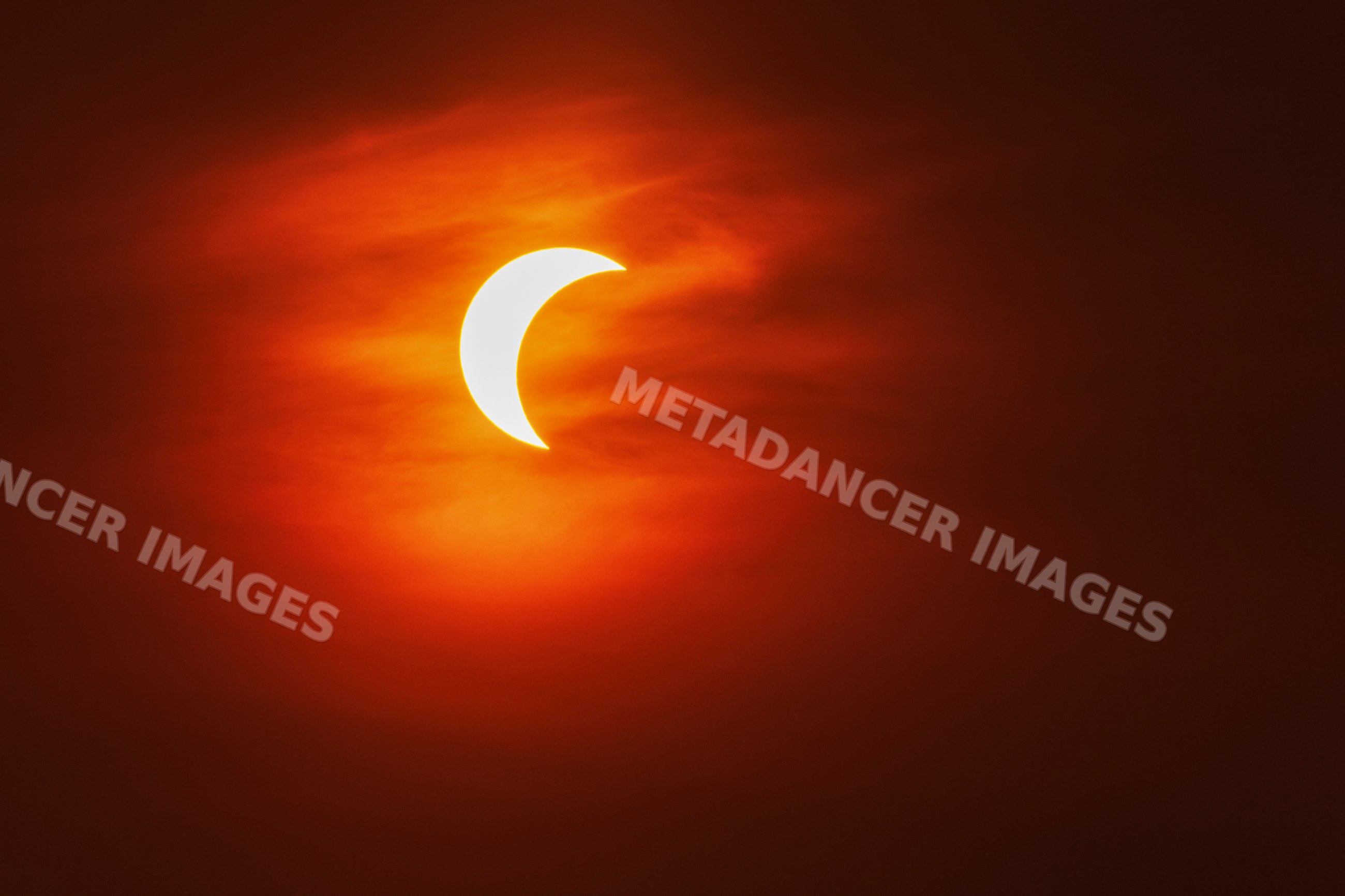 Partial solar eclipse over valldemossa sky in Mallorca Spain