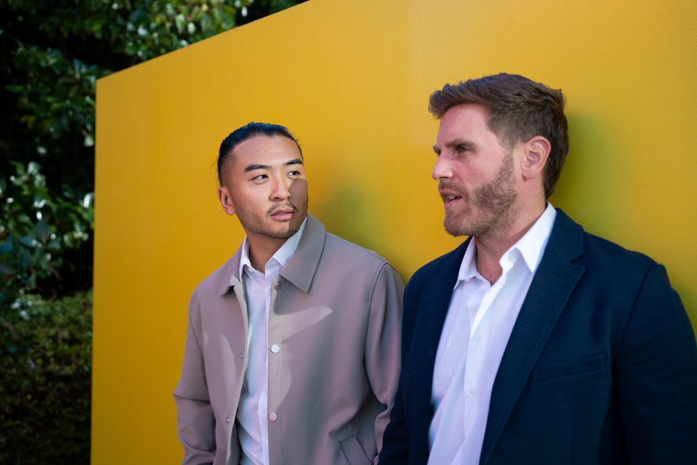 Two white men conversing outdoors