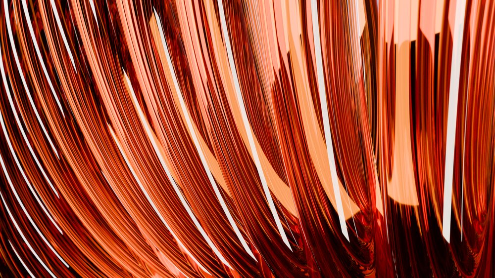 Abstract curved red and orange glass shapes with reflective patterns