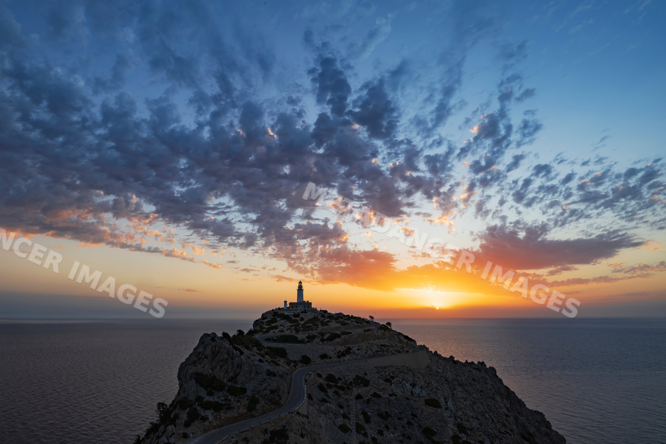 Lighthouse at sunrise on cap formentor cliff, Mallorca, Spain