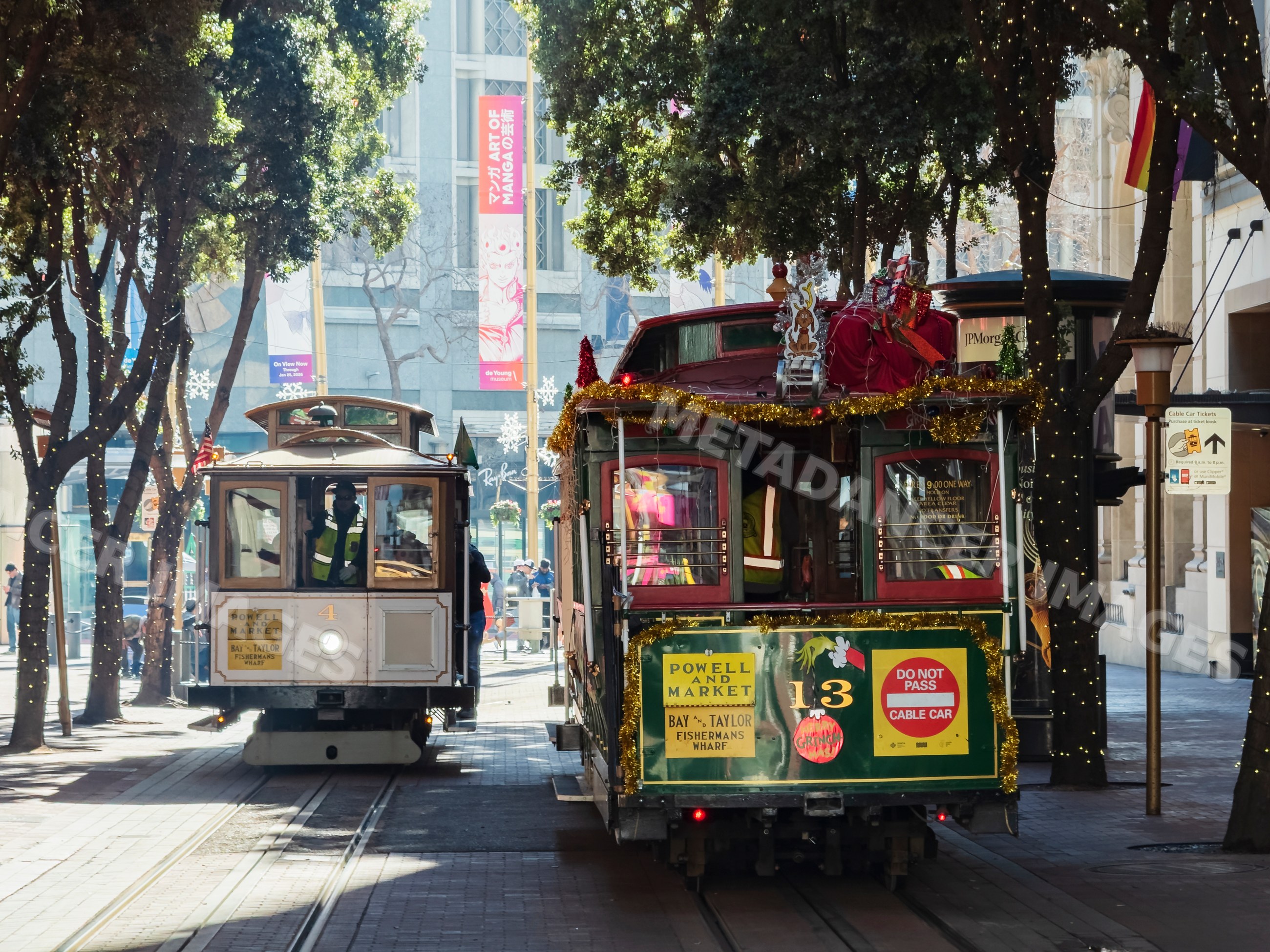 San Francisco cable cars on market street decorated for holiday season