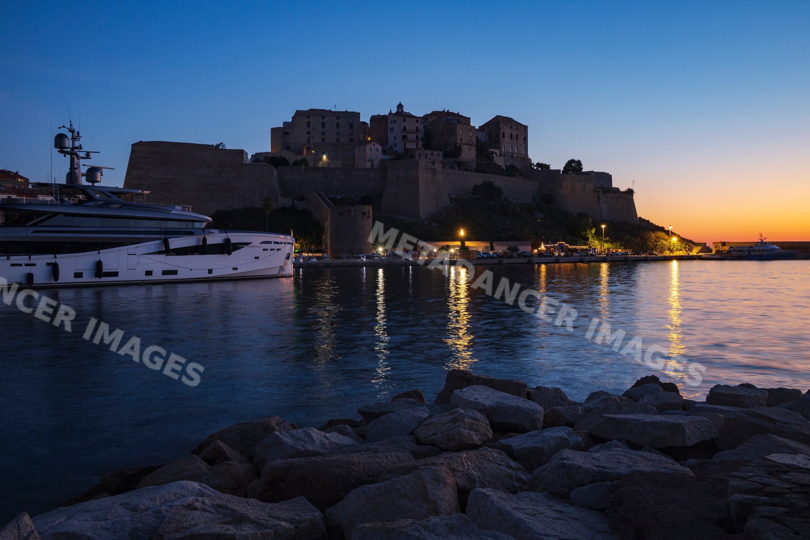 Citadel at Dawn overlooking Yacht in calvi harbor