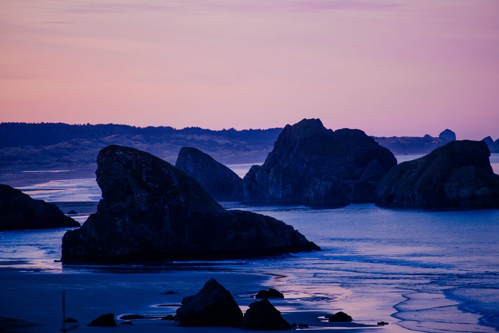 Sunset at rocky coastline with waves at meyers creek, Oregon