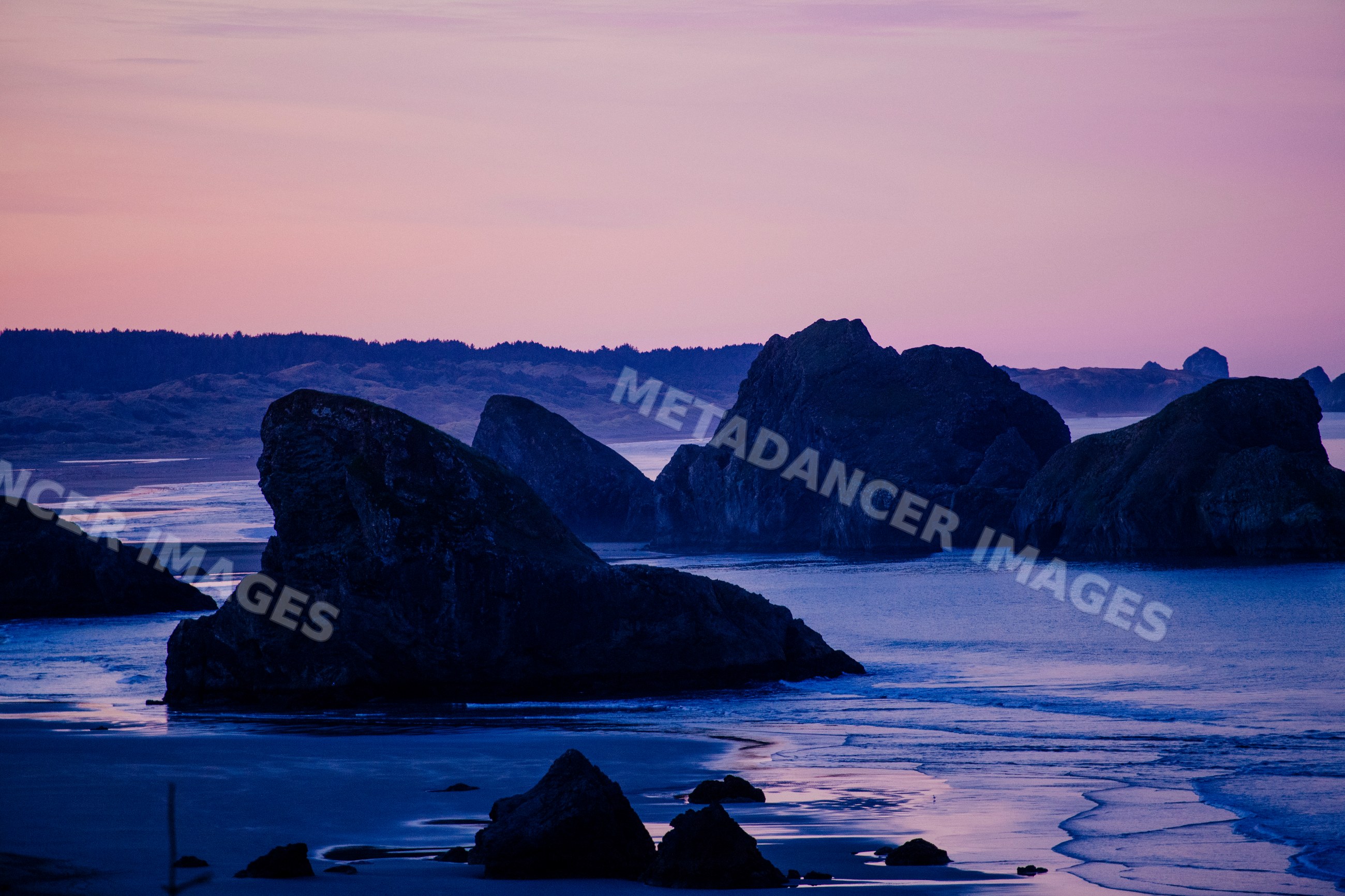 Sunset at rocky coastline with waves at meyers creek, Oregon