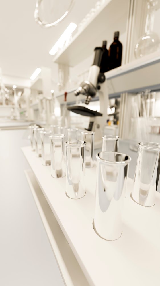 Test tubes on laboratory bench with microscope