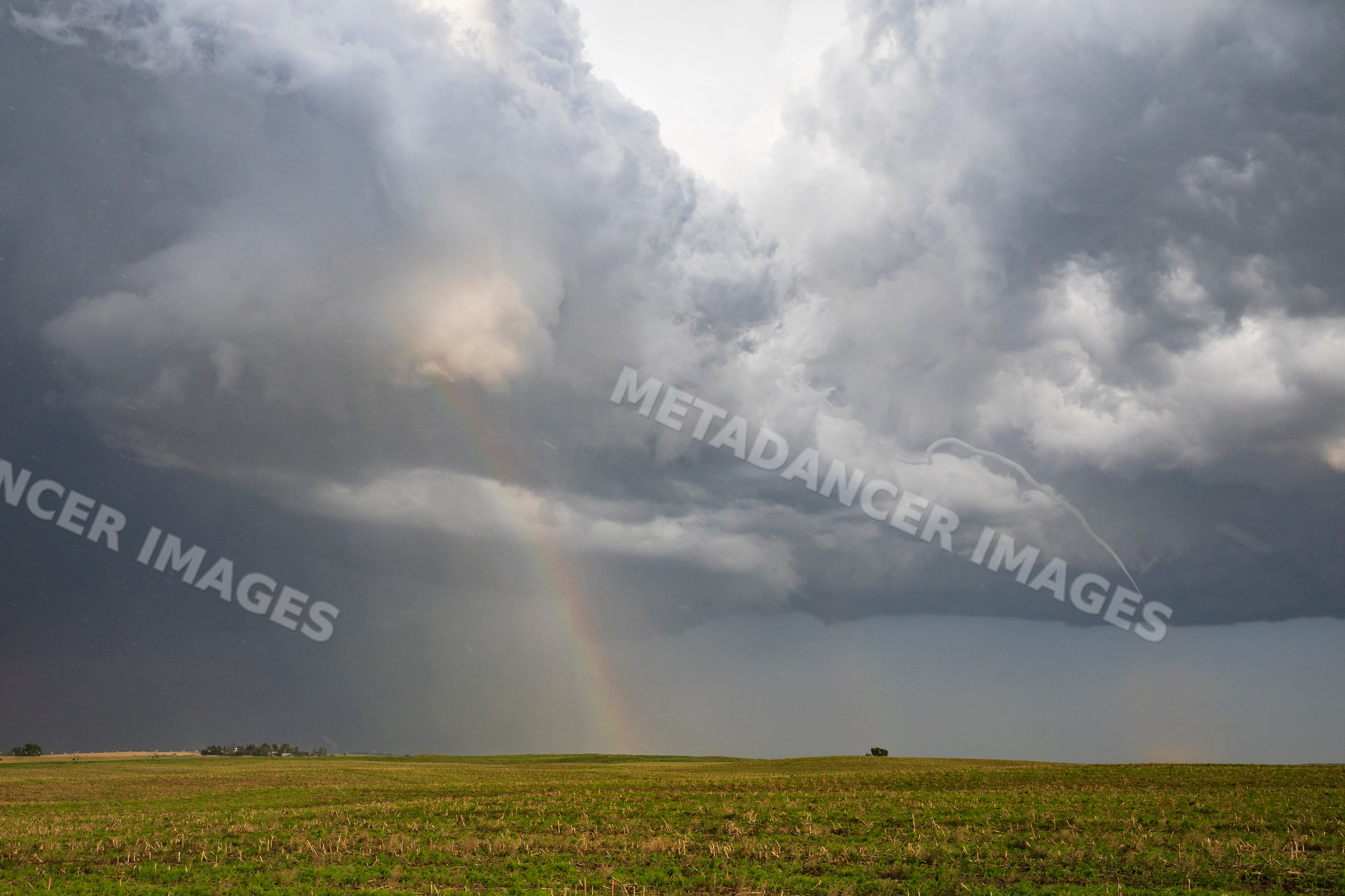 Small Rope Tornado and Double Rainbow over Great Plains field