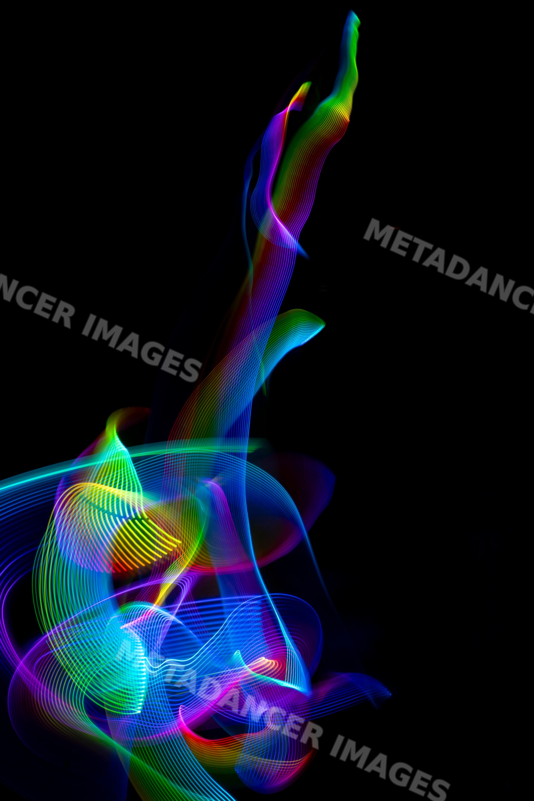 Colorful led light painting with abstract flowing trails on black