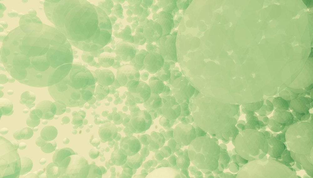 Multiple translucent green spheres floating